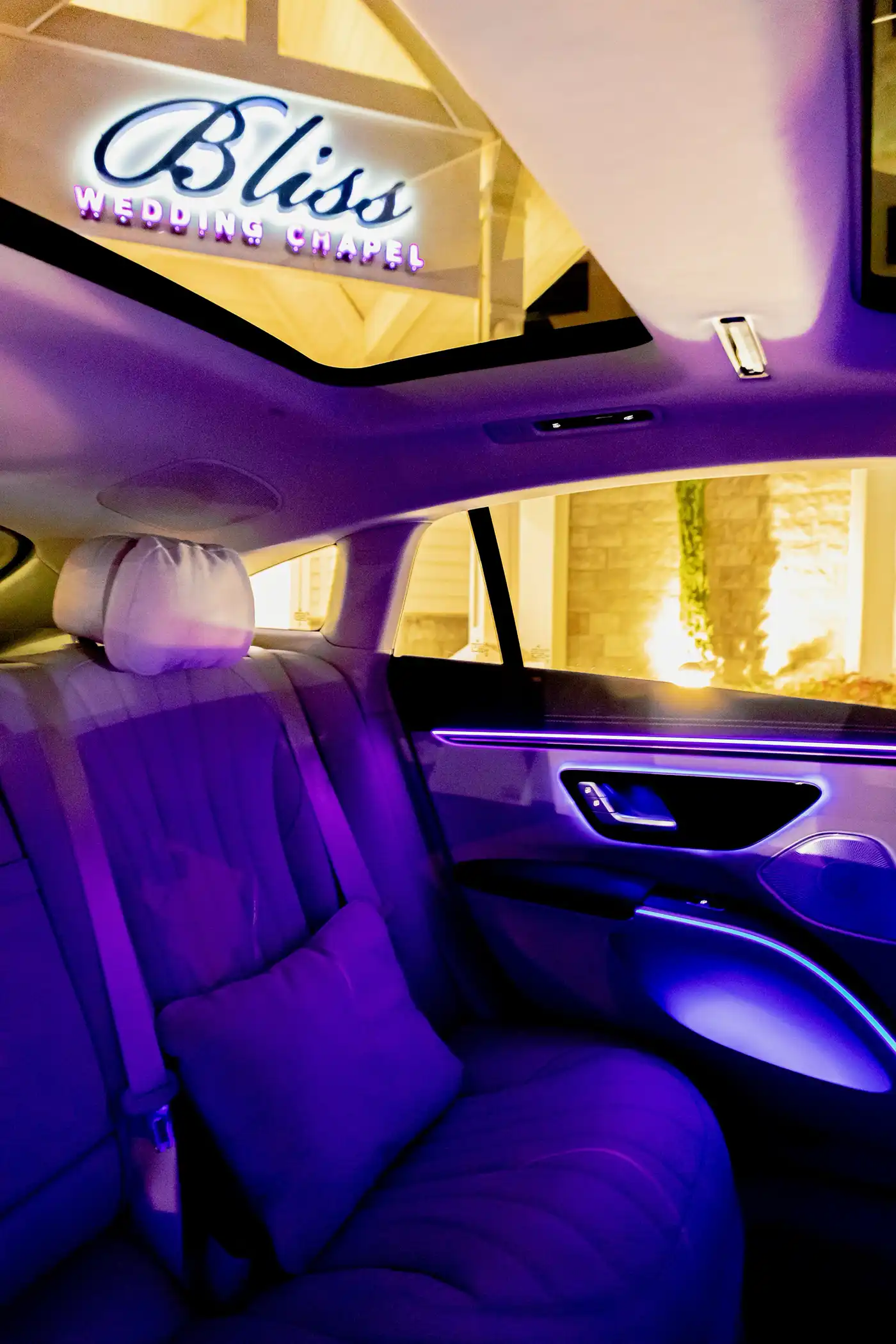 Mercedes EQS Luxury Transportation Interior with Bliss Wedding Chapel in background