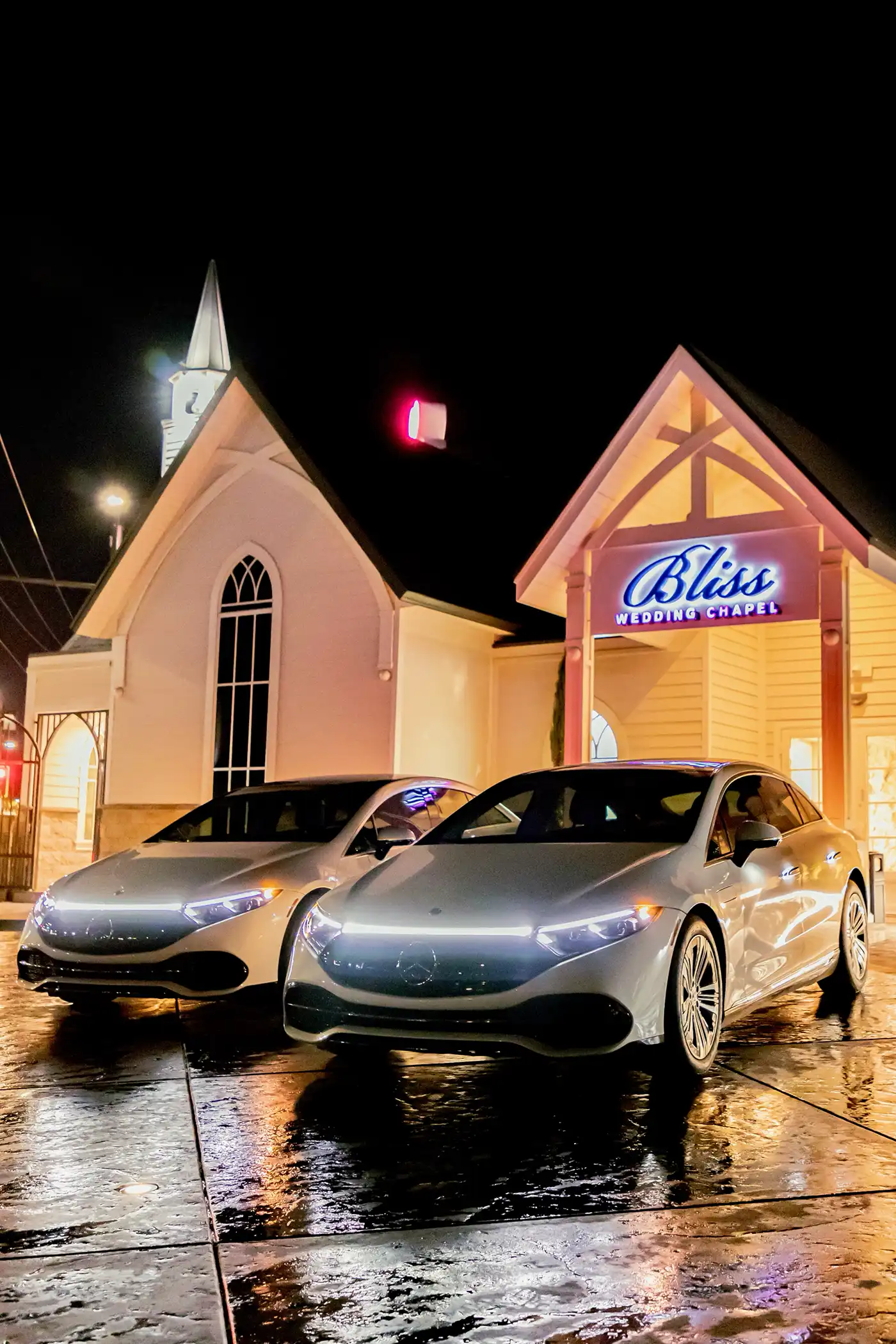 Mercedes EQS Series Luxury Transportation in front of Bliss Wedding Chapel